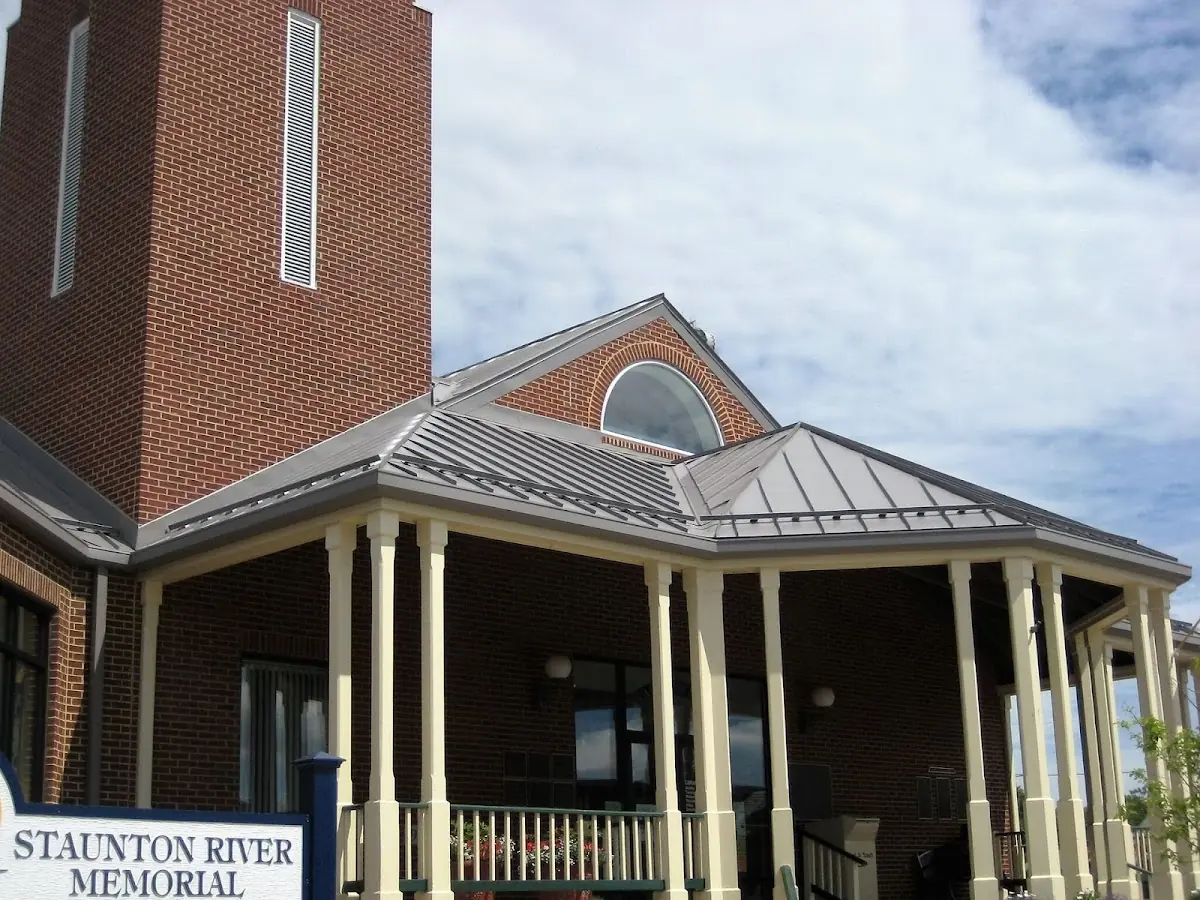 Skilled roofing craftsmen working on a residential roof in Meadville